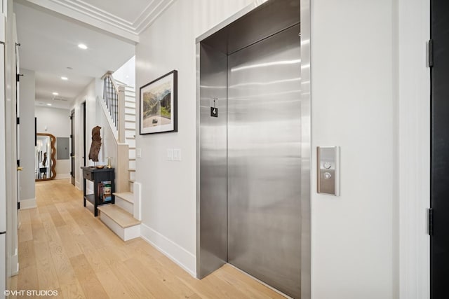 hallway featuring recessed lighting, stairs, elevator, light wood-style flooring, and baseboards