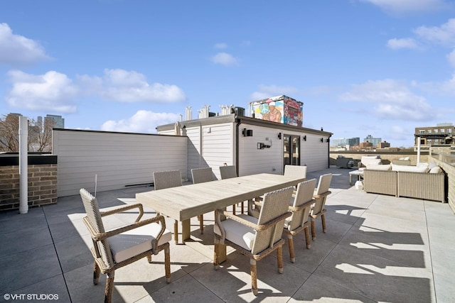 view of patio / terrace featuring an outdoor living space and outdoor dining space