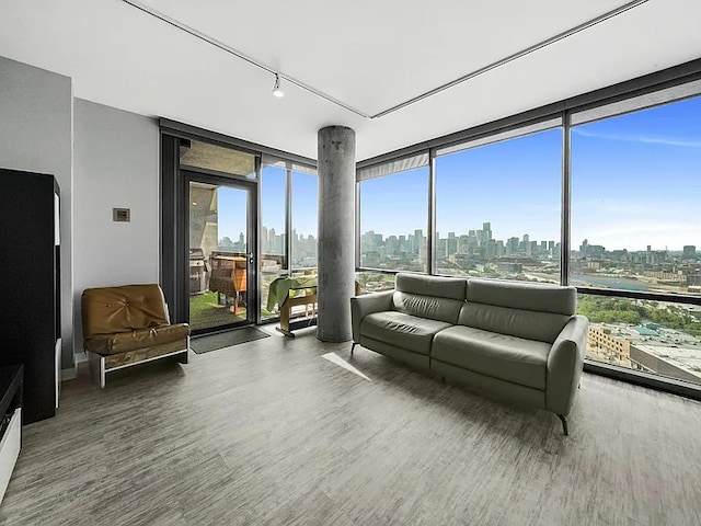 sunroom with a wealth of natural light and a view of city