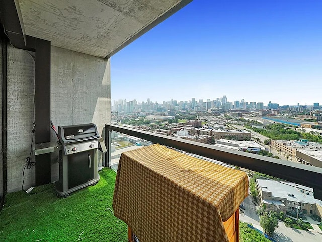 balcony featuring a city view and grilling area