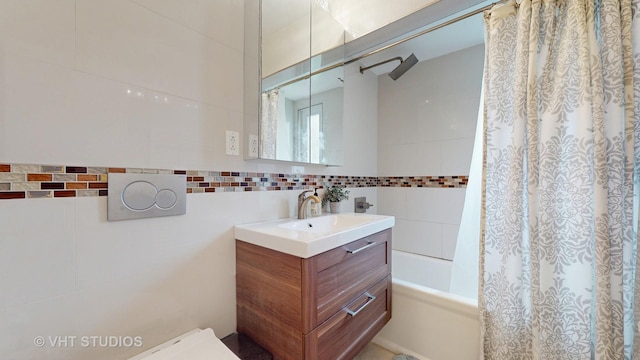 bathroom featuring vanity, shower / tub combo, and tile walls