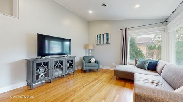 living area featuring baseboards, recessed lighting, wood finished floors, and lofted ceiling