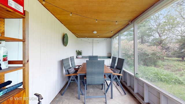 sunroom with outdoor dining space