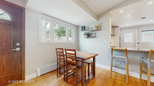 dining area featuring recessed lighting, baseboards, and light wood-style floors