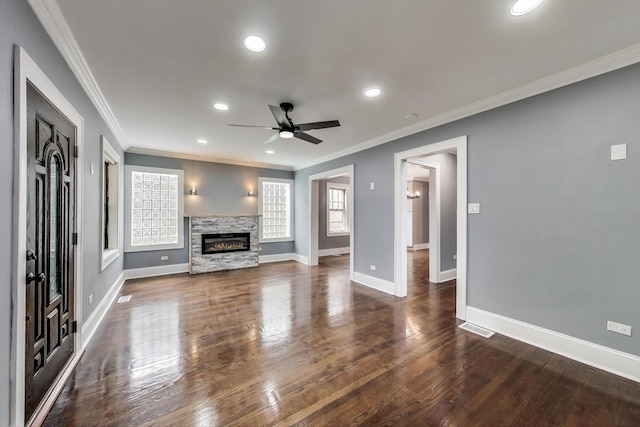 unfurnished living room with ceiling fan, baseboards, dark wood finished floors, recessed lighting, and crown molding