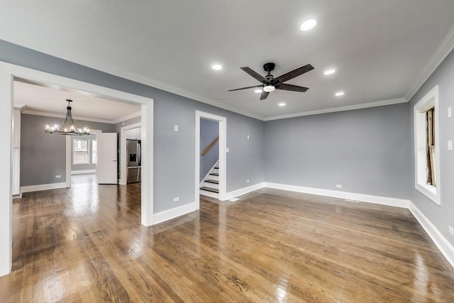 unfurnished room featuring a chandelier, stairs, a ceiling fan, recessed lighting, and baseboards