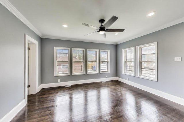 spare room with a ceiling fan, ornamental molding, dark wood-type flooring, recessed lighting, and baseboards