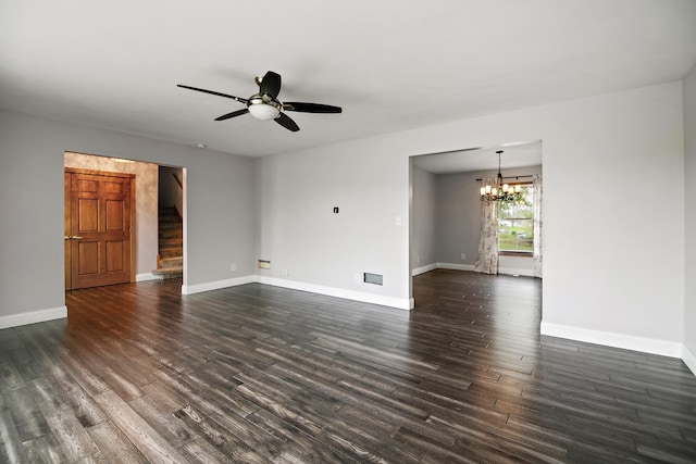 unfurnished living room featuring baseboards, ceiling fan with notable chandelier, and dark wood-style floors
