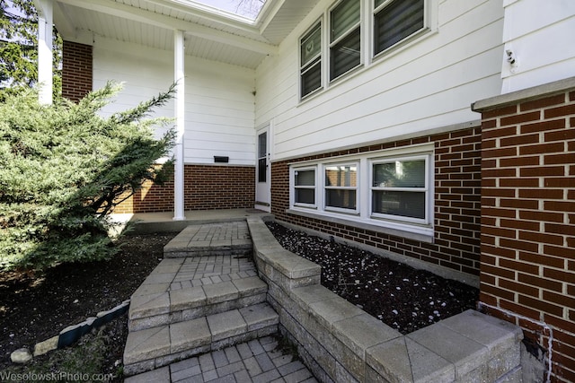 view of property exterior featuring brick siding