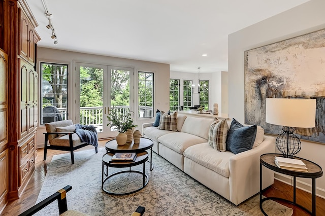 64 Huntington Ct, Burr Ridge, IL 60527 - living room featuring wood finished floors, baseboards, recessed lighting, and rail lighting