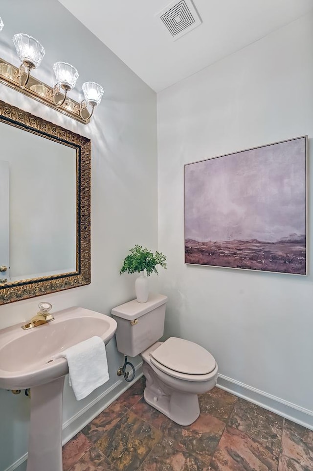 64 Huntington Ct, Burr Ridge, IL 60527 - bathroom with stone tile flooring, baseboards, and toilet