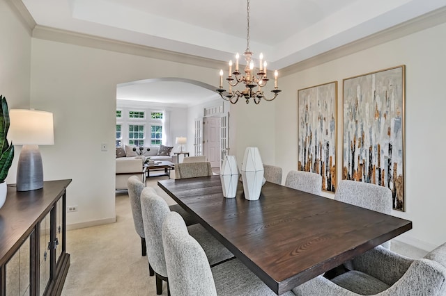 64 Huntington Ct, Burr Ridge, IL 60527 - dining space with arched walkways, a tray ceiling, a chandelier, crown molding, and baseboards