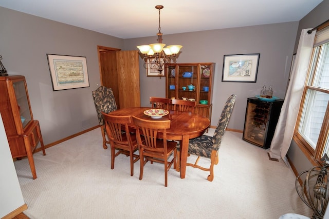 600 Salceda Dr, Mundelein, IL 60060 - dining room with a chandelier, light carpet, healthy amount of natural light, and baseboards