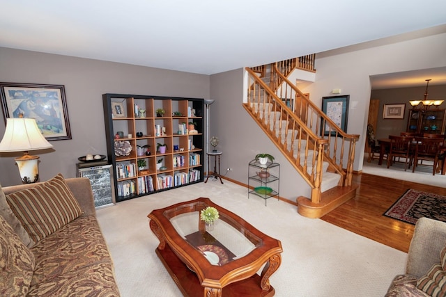 600 Salceda Dr, Mundelein, IL 60060 - living area featuring stairway, carpet floors, baseboards, and a chandelier