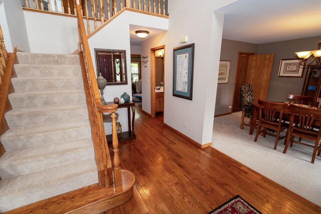 600 Salceda Dr, Mundelein, IL 60060 - entryway featuring stairs, wood finished floors, baseboards, and a chandelier