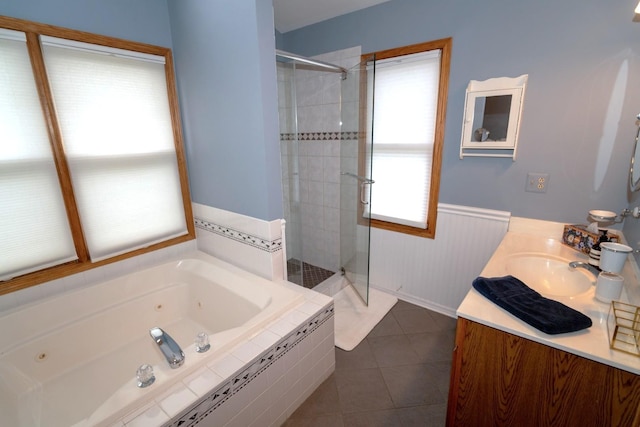 600 Salceda Dr, Mundelein, IL 60060 - full bathroom featuring a shower stall, a tub with jets, vanity, a wainscoted wall, and tile patterned floors