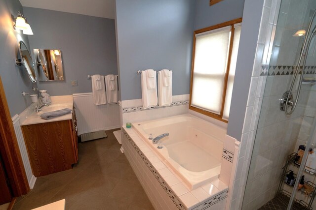 600 Salceda Dr, Mundelein, IL 60060 - full bath featuring a bath, vanity, a stall shower, wainscoting, and tile patterned floors
