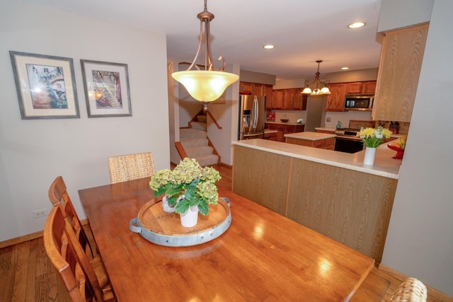 600 Salceda Dr, Mundelein, IL 60060 - dining space with wood finished floors, stairway, a chandelier, recessed lighting, and baseboards