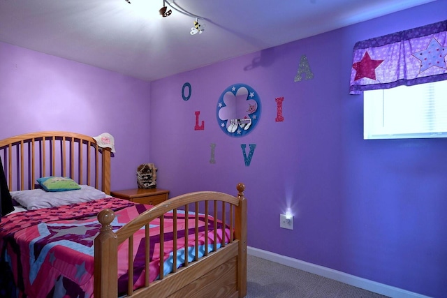 bedroom with carpet and baseboards