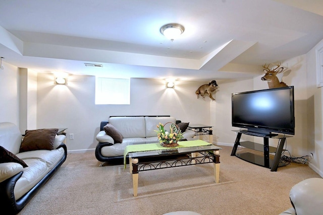 living area featuring carpet flooring and baseboards