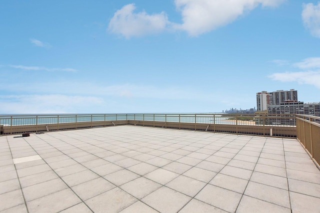 view of patio featuring a water view