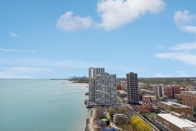 exterior space featuring a view of city and a water view