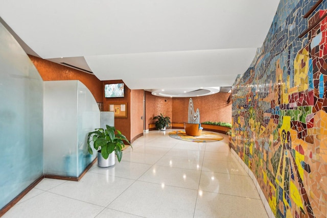 hall featuring baseboards