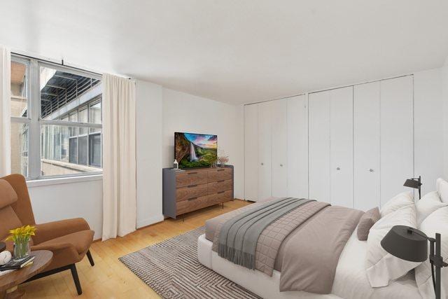 bedroom with light wood finished floors