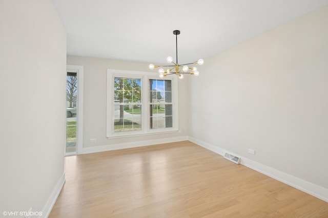 1816 W Pheasant Trl, Mount Prospect, IL 60056 - unfurnished room with an inviting chandelier, visible vents, light wood finished floors, and baseboards