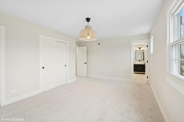 1816 W Pheasant Trl, Mount Prospect, IL 60056 - interior space featuring visible vents, baseboards, light carpet, and a healthy amount of sunlight