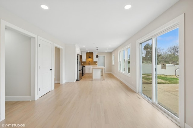 1816 W Pheasant Trl, Mount Prospect, IL 60056 - unfurnished living room with light wood-type flooring, recessed lighting, and baseboards