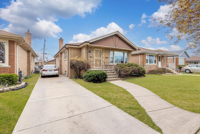 8515 S Kildare Ave, Chicago, IL 60652 - view of front of house with concrete driveway, brick siding, a chimney, and a front lawn