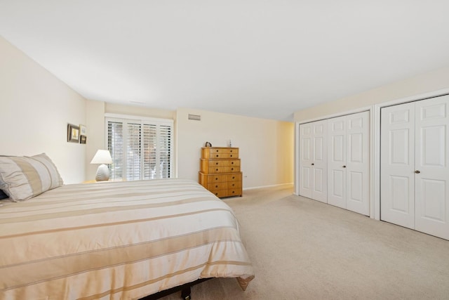 1401 Burr Oak Rd Unit 116B, Hinsdale, IL 60521 - bedroom featuring carpet floors, two closets, and visible vents