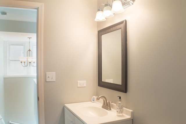 227 E 6th St, Lockport, IL 60441 - bathroom with a chandelier and vanity