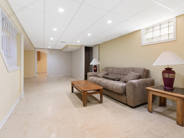 living area featuring recessed lighting and baseboards