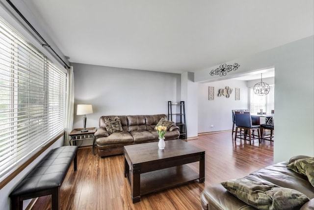 1214 Lone Oak Trl, Aurora, IL 60506 - living room with healthy amount of natural light, wood finished floors, and a chandelier