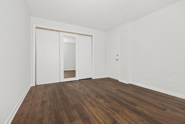 720 N Austin Blvd Unit Gnw, Oak Park, IL 60302 - unfurnished bedroom with a closet, dark wood-style floors, and baseboards