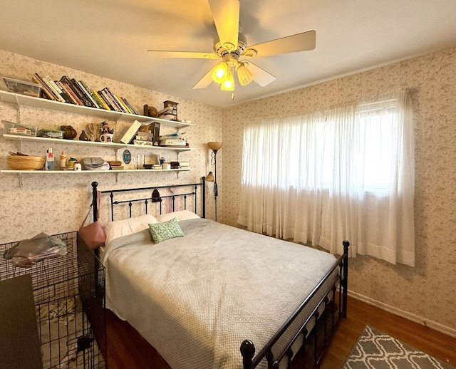 bedroom featuring wallpapered walls and dark wood-type flooring