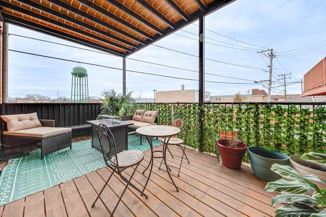 wooden deck with an outdoor hangout area