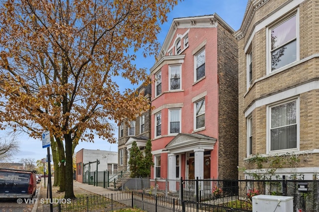 2534 S Christiana Ave, Chicago, IL 60623 - view of front of home with brick siding and a fenced front yard