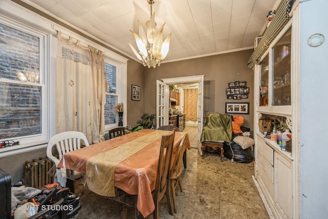2534 S Christiana Ave, Chicago, IL 60623 - dining area with ornamental molding, radiator heating unit, and a chandelier