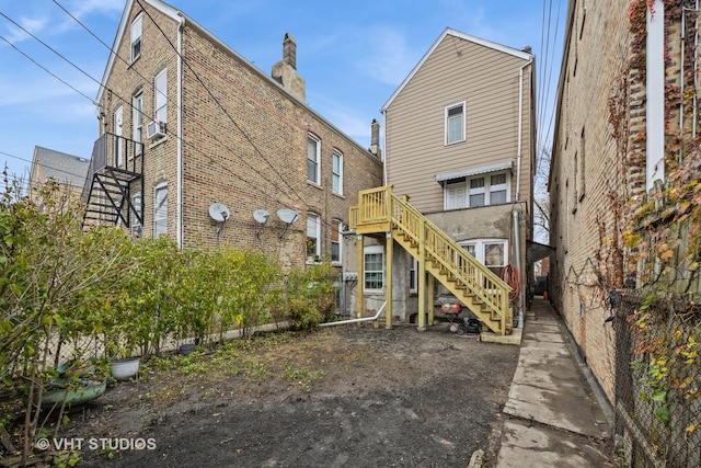 2534 S Christiana Ave, Chicago, IL 60623 - rear view of house with brick siding, cooling unit, and stairs