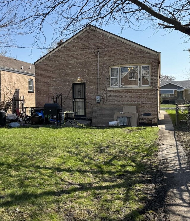 10434 S Green St, Chicago, IL 60643 - back of house with a lawn, fence, and brick siding