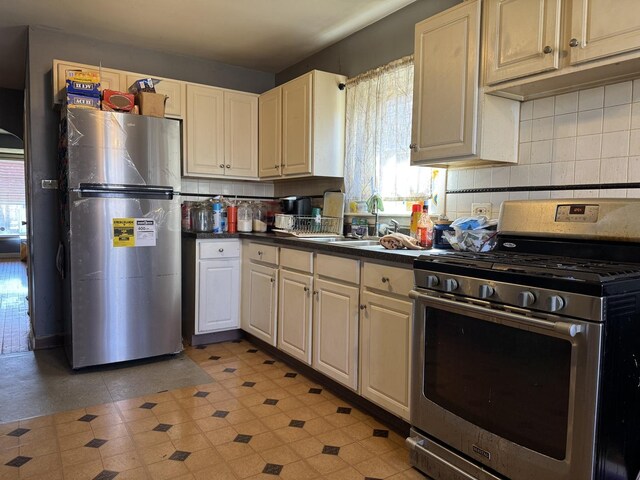 10434 S Green St, Chicago, IL 60643 - kitchen featuring a wealth of natural light, stainless steel appliances, backsplash, and a sink