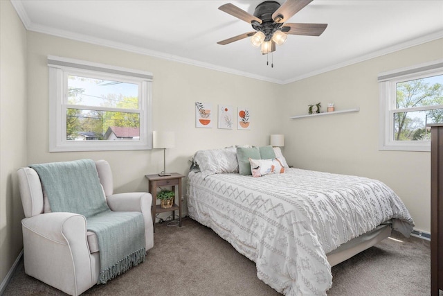 carpeted bedroom featuring crown molding and ceiling fan