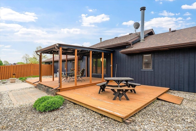 911 E Main St, Plano, IL 60545 - wooden deck with outdoor dining space and fence