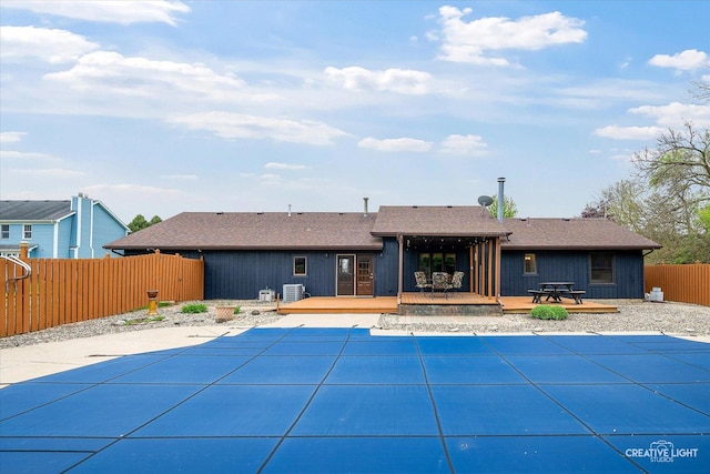 911 E Main St, Plano, IL 60545 - back of property with a deck, a fenced backyard, and a shingled roof