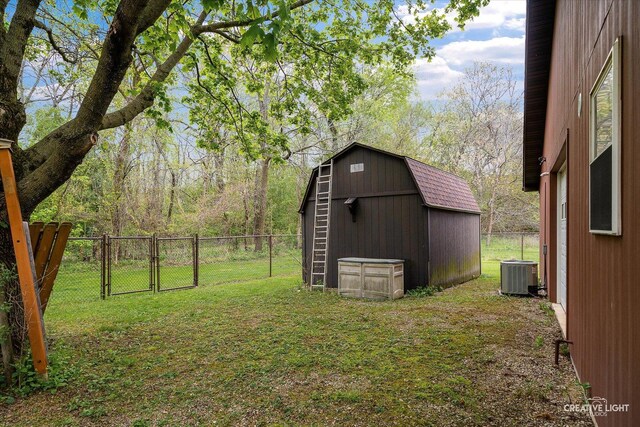 911 E Main St, Plano, IL 60545 - view of shed with a gate and central AC unit