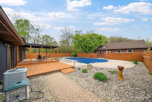 911 E Main St, Plano, IL 60545 - view of pool with a wooden deck, central AC, a fenced backyard, and a patio