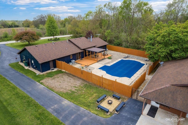 911 E Main St, Plano, IL 60545 - view of pool featuring a fenced backyard and a deck